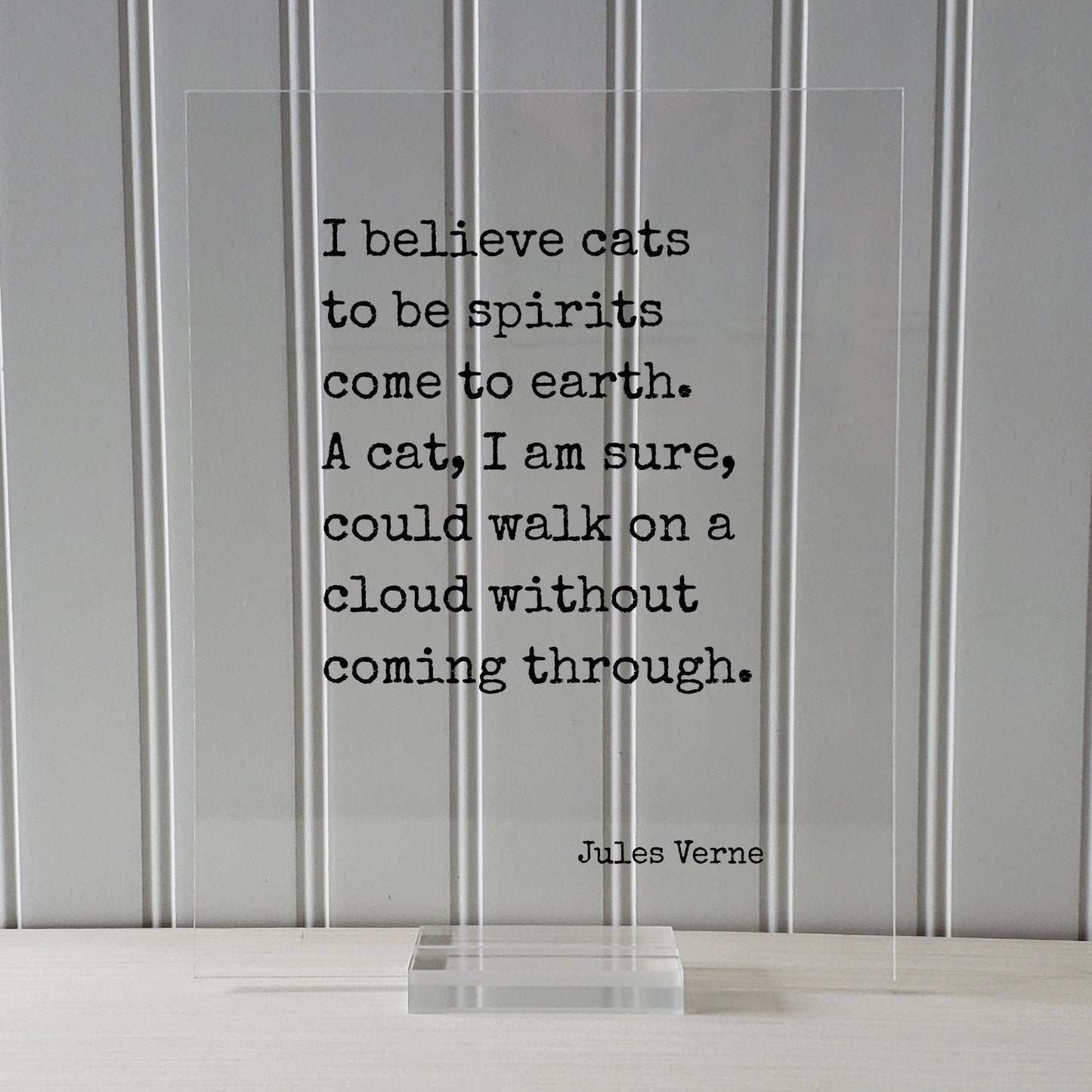 Cat Quote - Jules Verne - I believe cats to be spirits come to earth. A cat, I am sure, could walk on a cloud without coming through