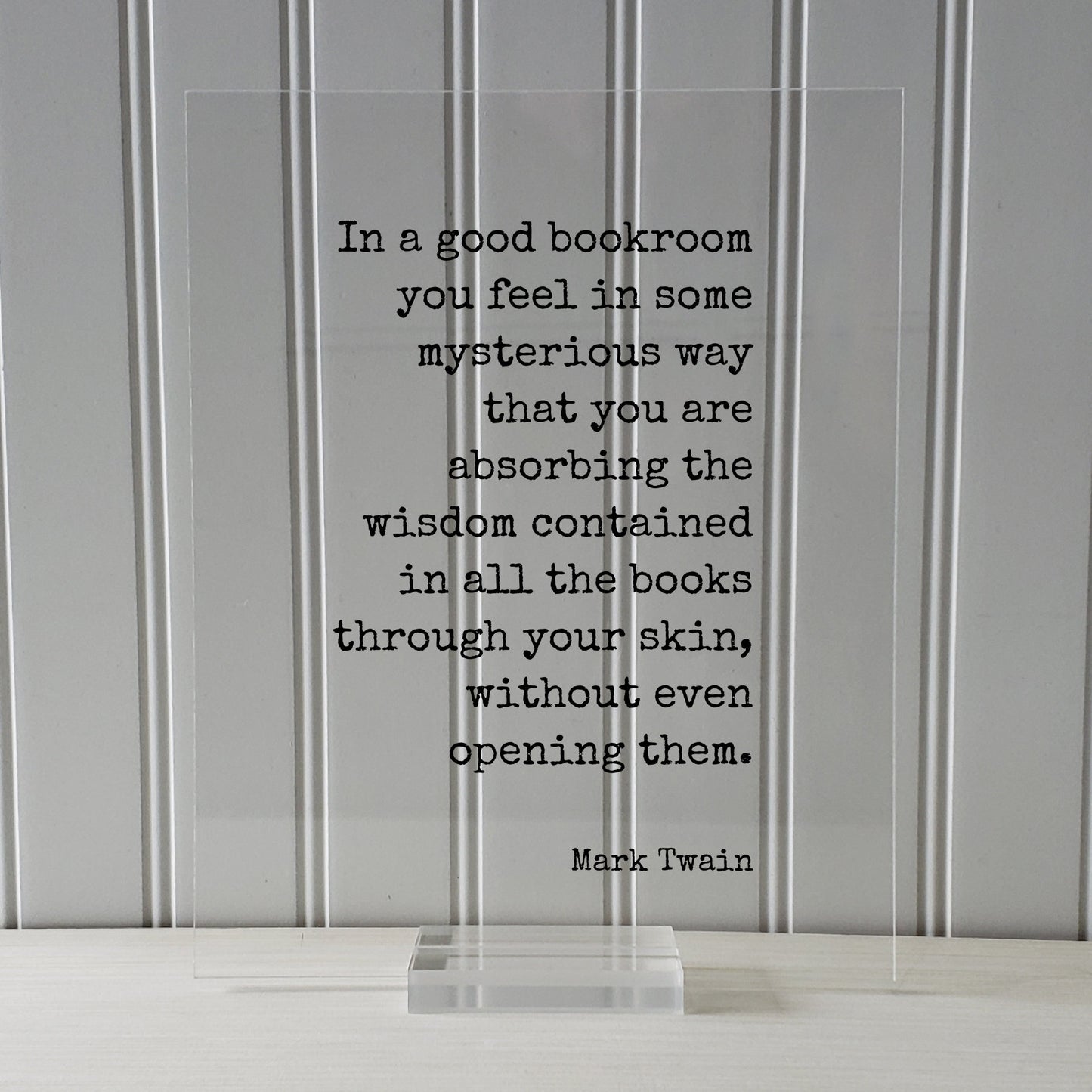 Mark Twain - In a good bookroom you feel in some mysterious way that you are absorbing the wisdom contained in the books through your skin
