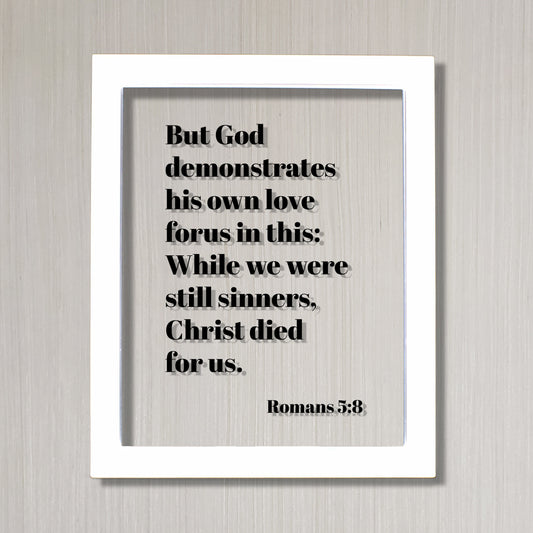 Romans 5:8 - But God demonstrates his own love for us in this While we were still sinners Christ died for us - Scripture Frame - Bible Verse