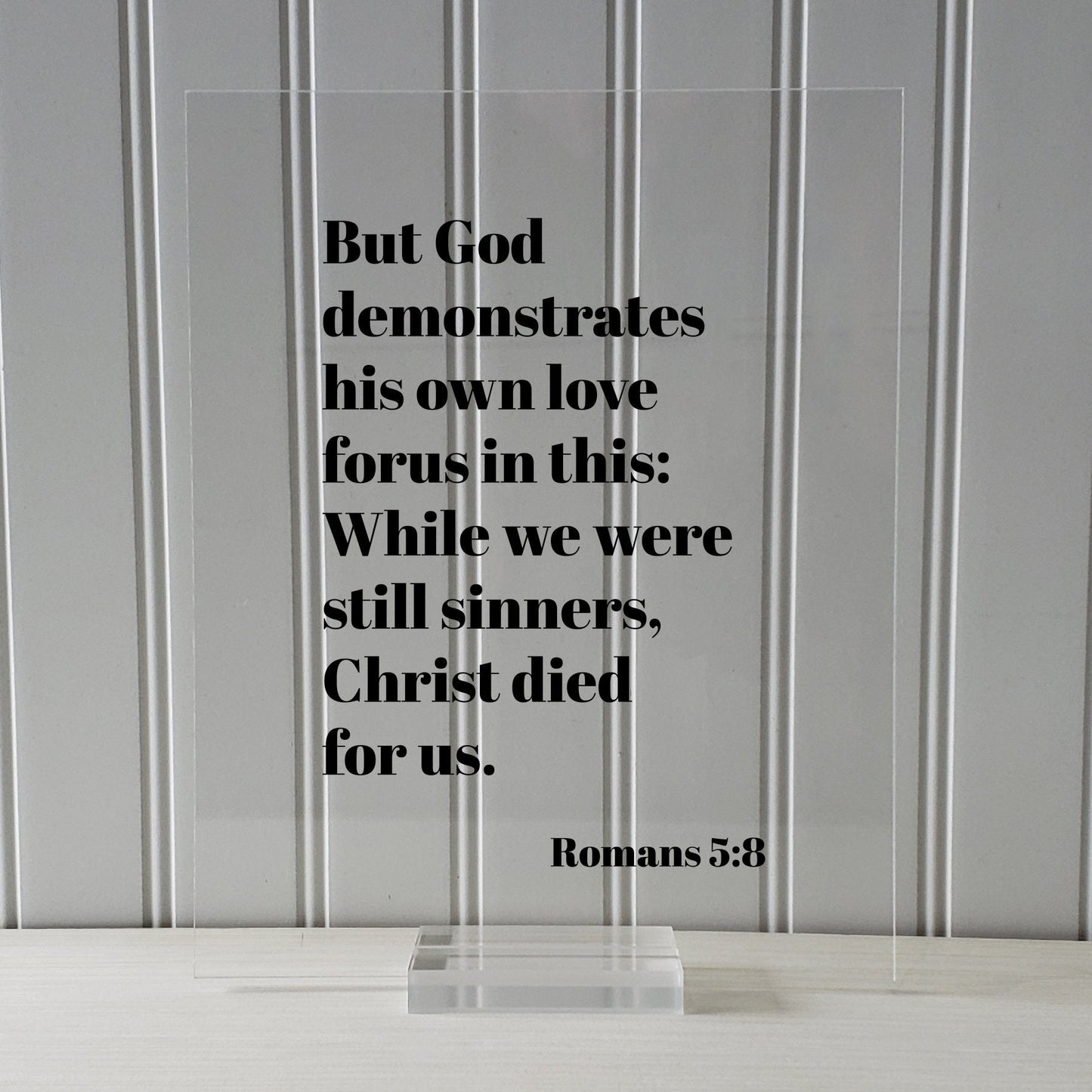 Romans 5:8 - But God demonstrates his own love for us in this While we were still sinners Christ died for us - Scripture Frame - Bible Verse