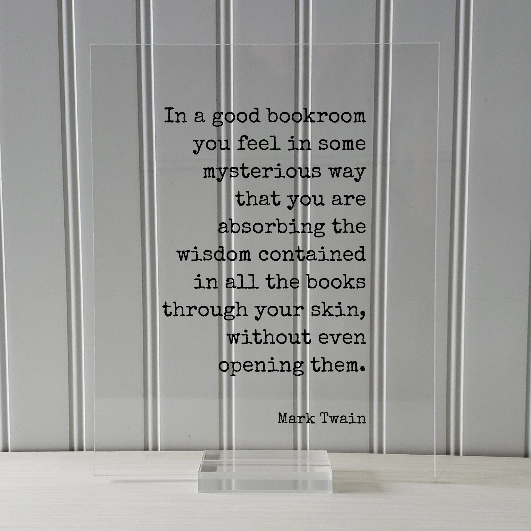 Mark Twain - In a good bookroom you feel in some mysterious way that you are absorbing the wisdom contained in the books through your skin