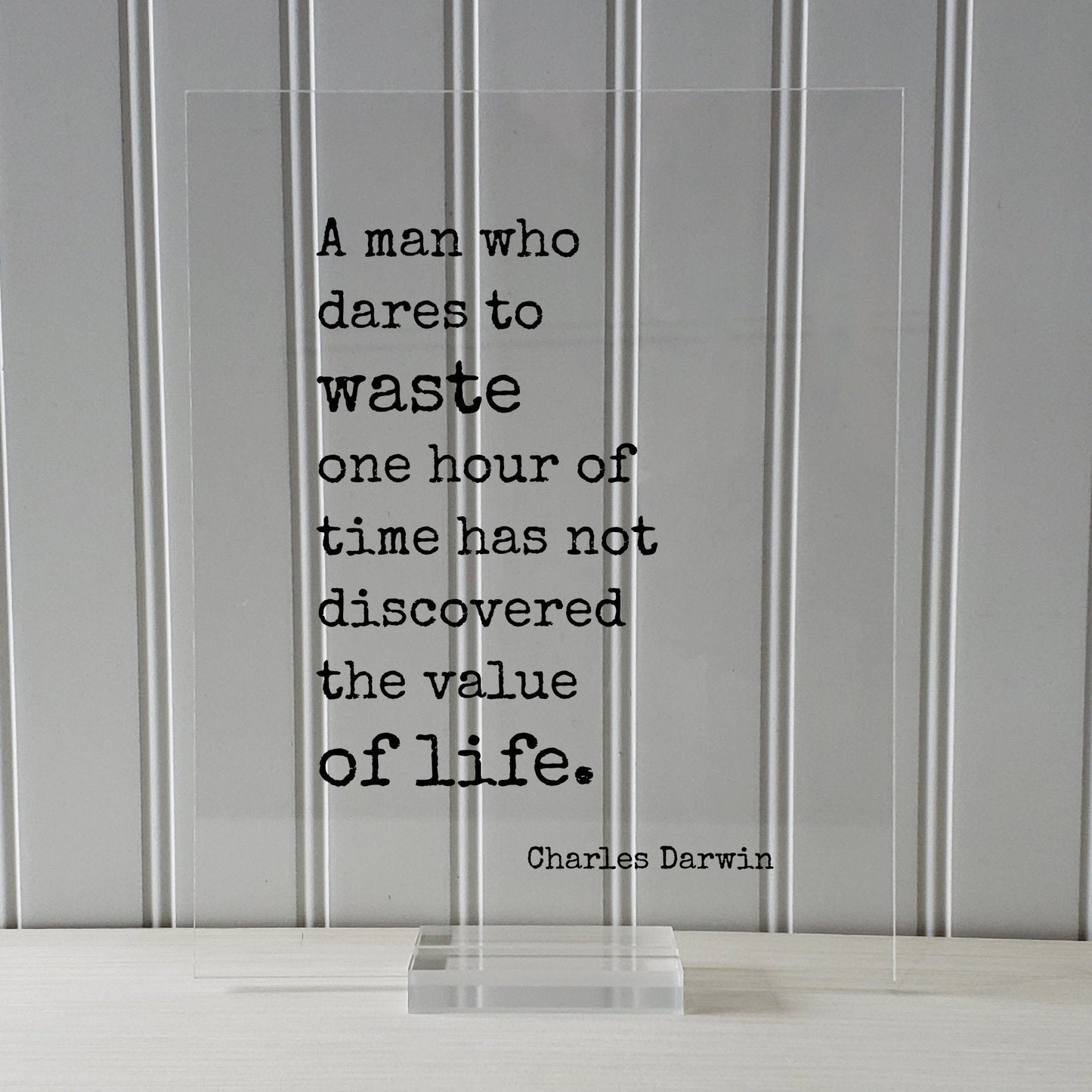 Charles Darwin - Floating Quote - A man who dares to waste one hour of time has not discovered the value of life - Time Management
