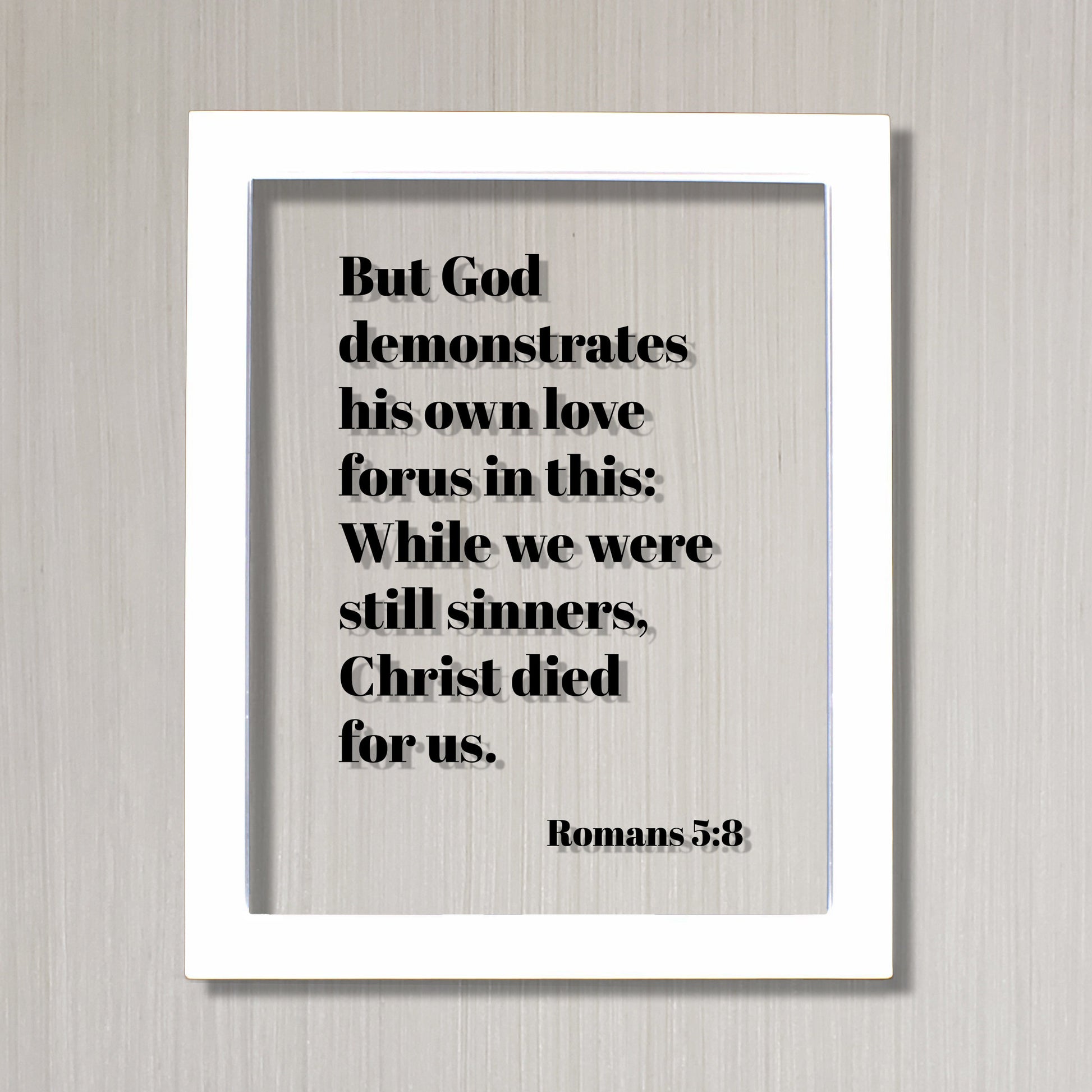 Romans 5:8 - But God demonstrates his own love for us in this While we were still sinners Christ died for us - Scripture Frame - Bible Verse