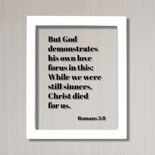 Romans 5:8 - But God demonstrates his own love for us in this While we were still sinners Christ died for us - Scripture Frame - Bible Verse